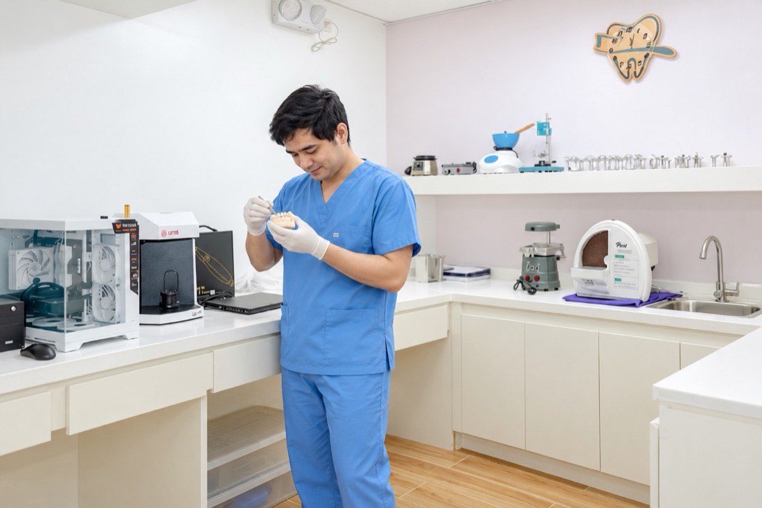A technician shaping a dental restoration in our in-house laboratory